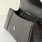 Balenciaga bag interior close-up with BALENCIAGA logo and croc-embossed trim, gray and black