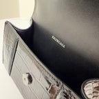 Balenciaga interior lining and croc-pattern edge detail on handbag