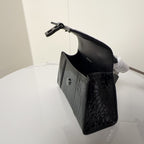 Light gray croc-texture handbag with side pocket and black bottom panel