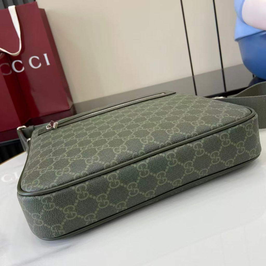 Gucci GG canvas clutch bag with long zip and matching green leather trim