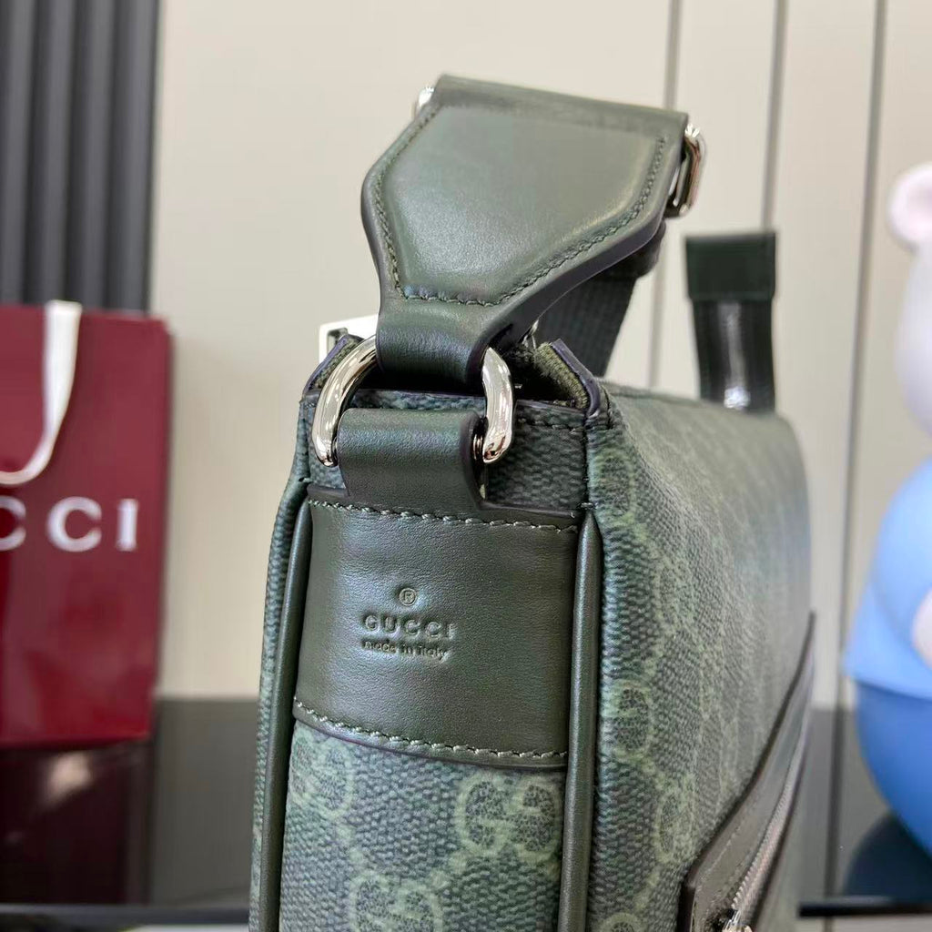 Gucci GG canvas bag top close-up with leather strap and clasp detail