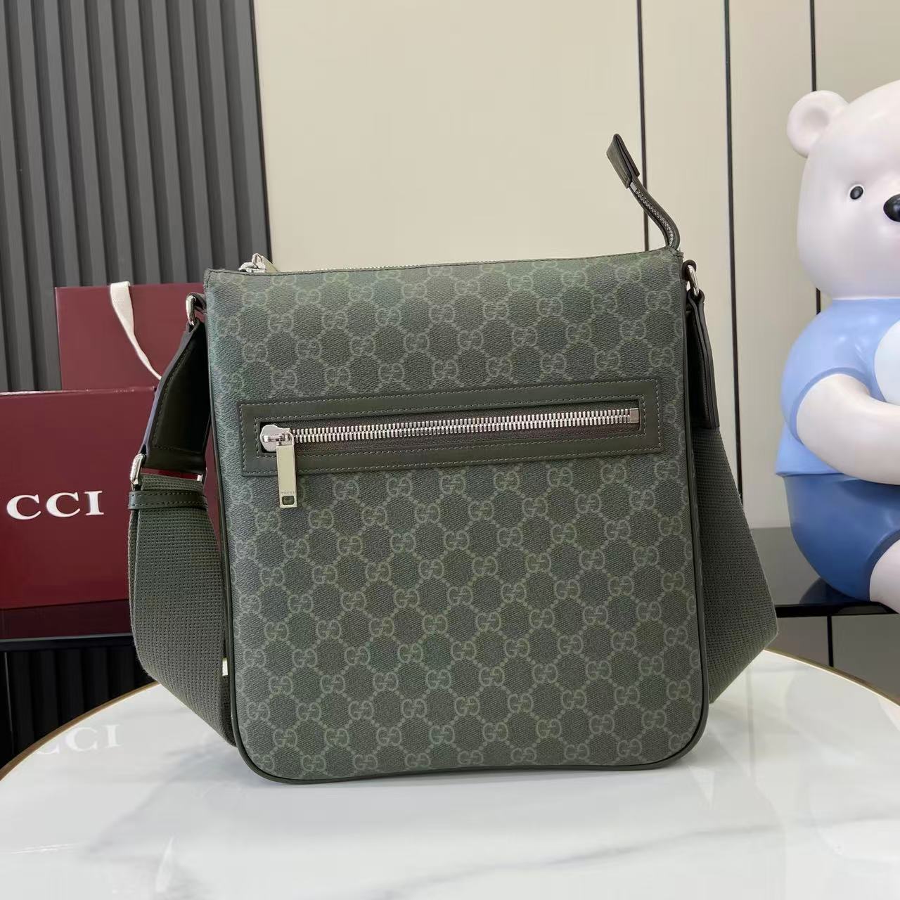 Gucci GG canvas shoulder bag with zip-front and dark green leather trim