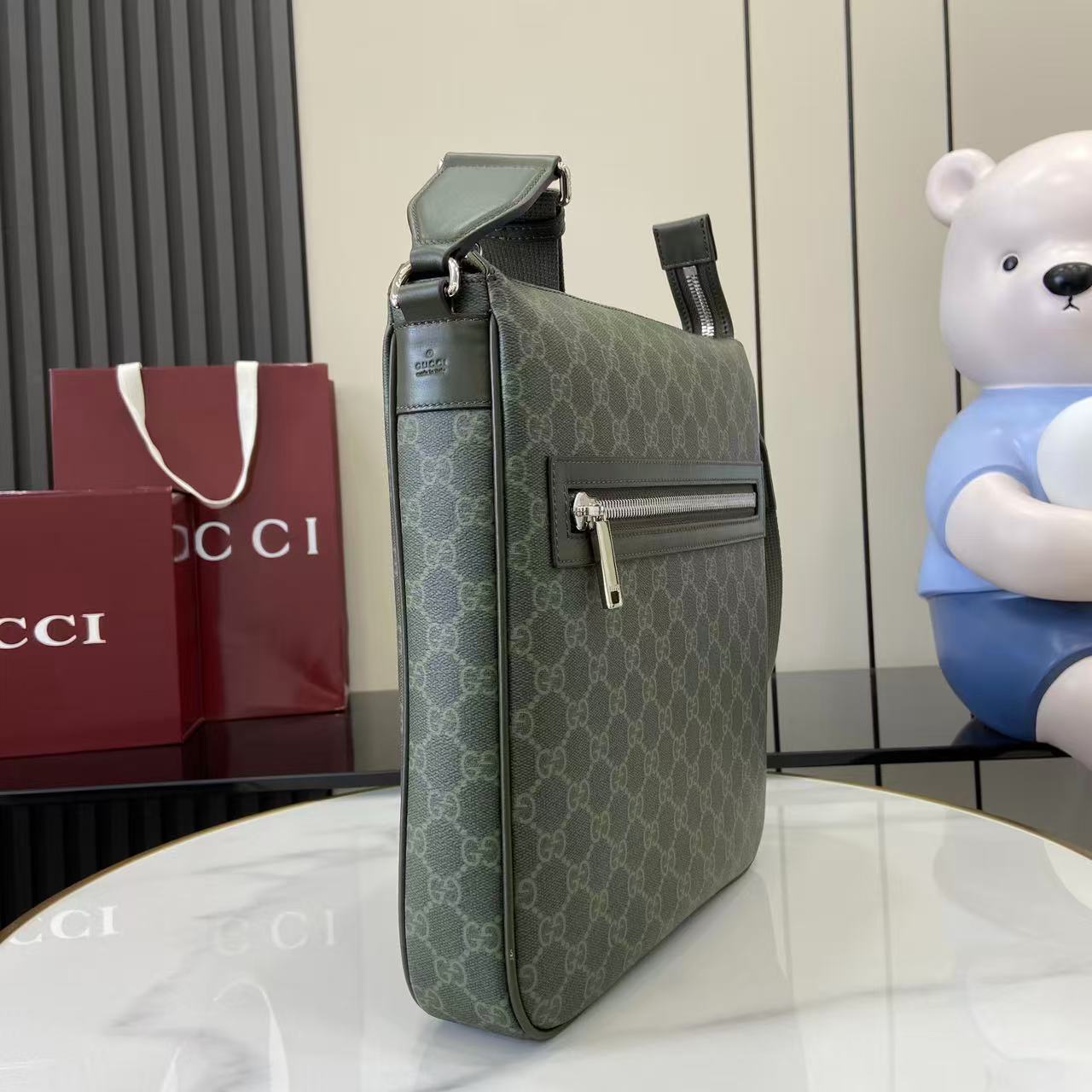 Gucci GG canvas crossbody bag with flap pocket and adjustable strap