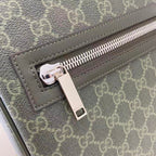 Gucci GG canvas bag close-up of silver-tone zipper pull and leather trim