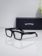 Rectangular eyeglasses with dark blue frames and gold bridge and temple detailing