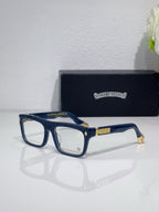 Rectangular eyeglasses with dark blue frames and gold temple logo accents