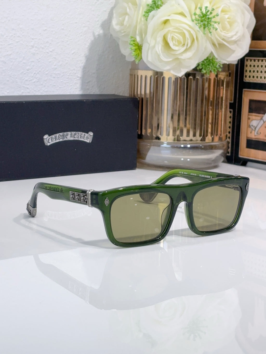 Chrome glasses with green frames and light tan lenses, wide rectangular eyeglasses