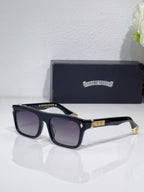 Chrome glasses with dark frames and dark-tinted lenses, gold inlay on temples