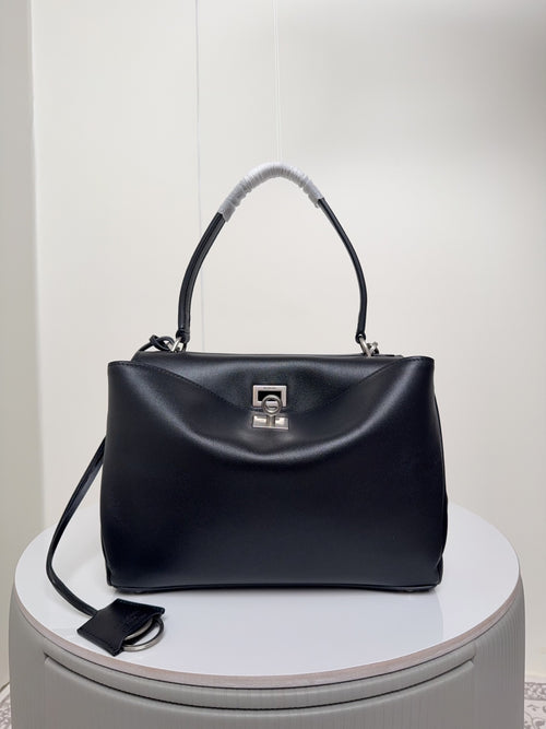 Balenciaga bag, dark leather with top handle and front logo plaque