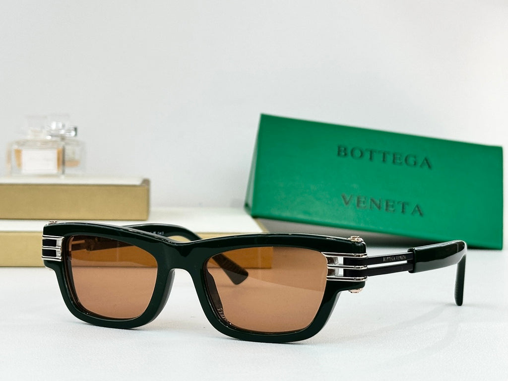 Dark green sunglasses with brown-tinted lenses and gold-tone metal hinge accents.