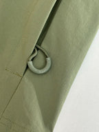 Moncler long jacket olive green with drawcord and small metal ring pull near hem