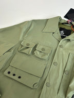 Moncler long jacket in olive green with flap pockets and buttoned cuff detail