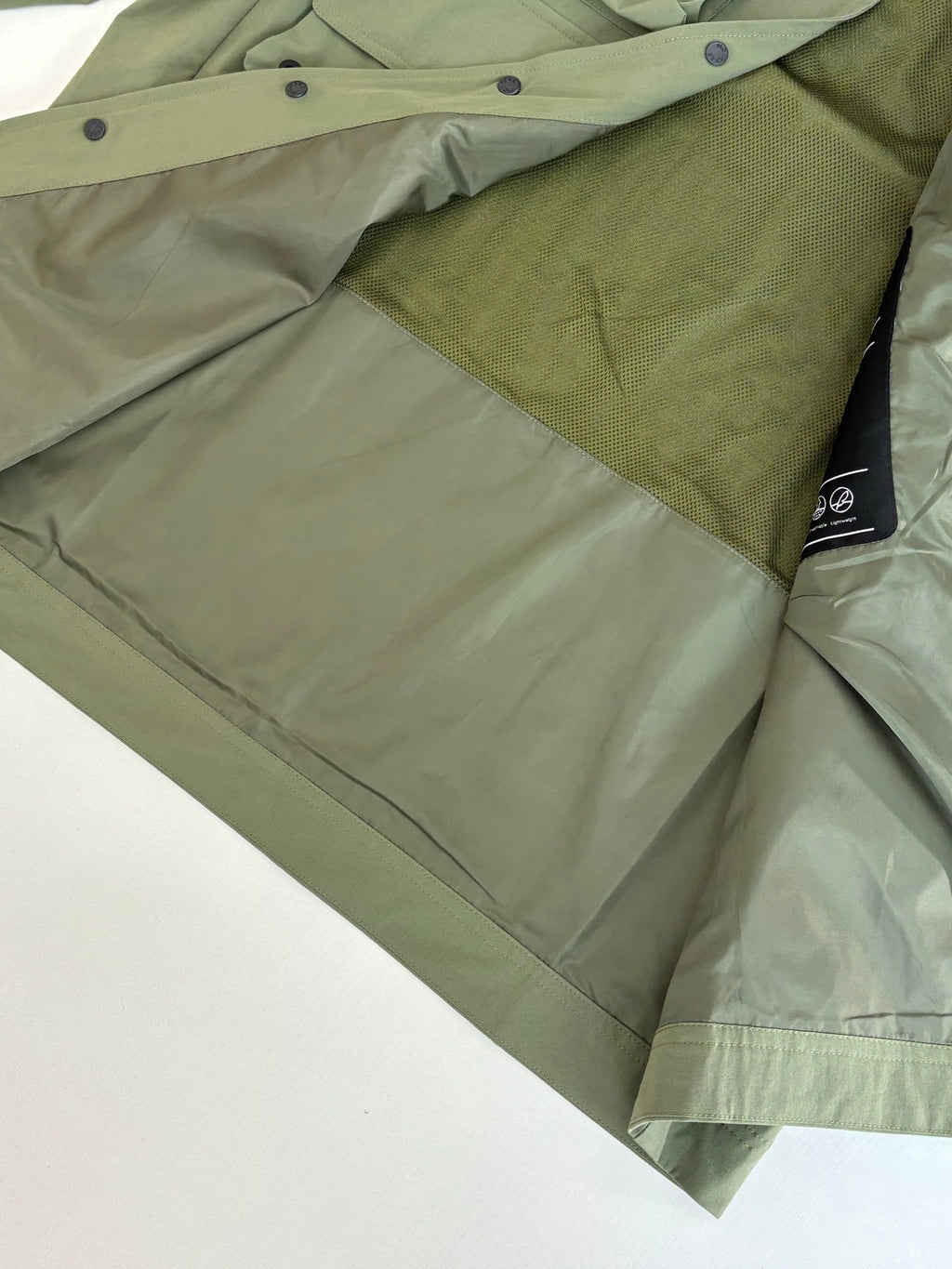 Moncler long olive coat with snap buttons and dark inner hood trim