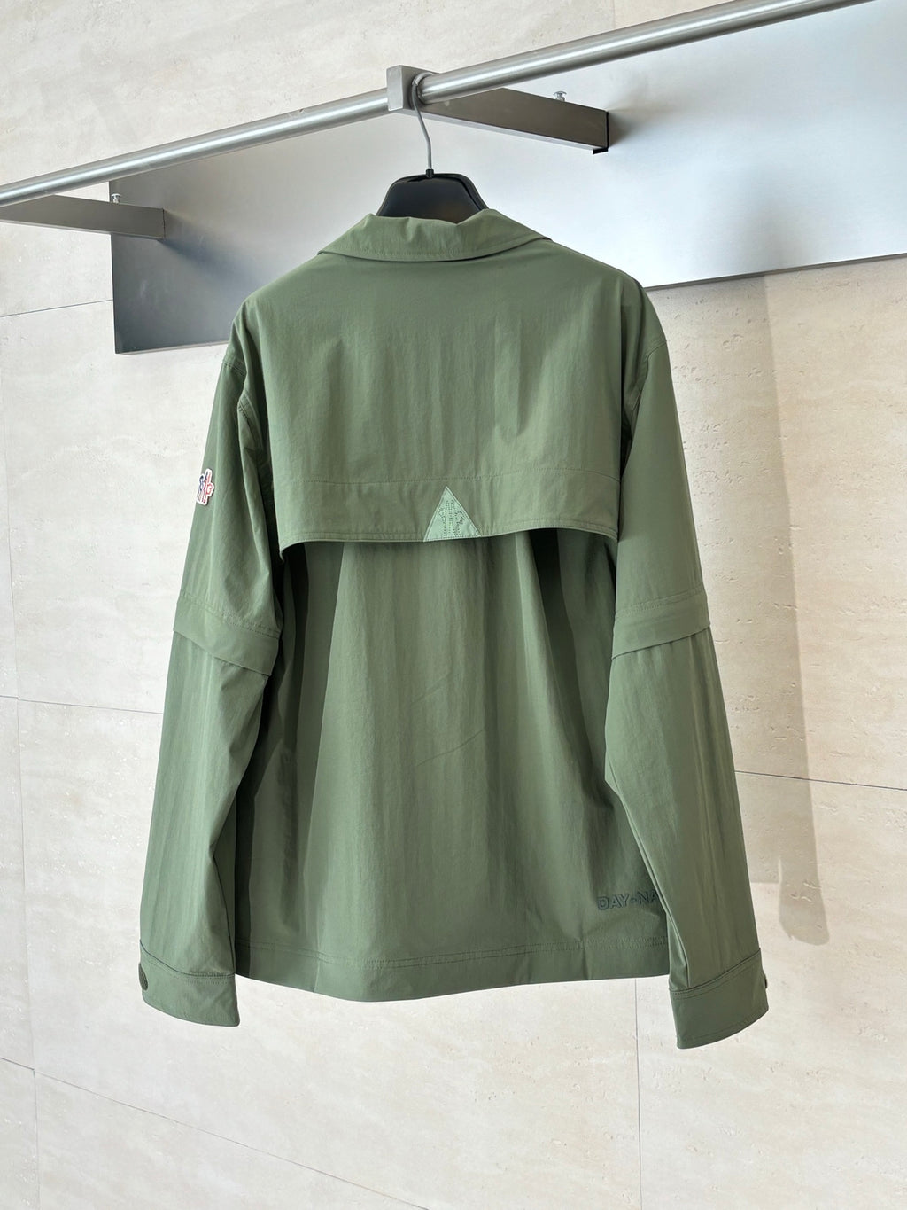 Moncler long jacket in olive green, back view with stand collar and yoke seam