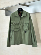 Moncler long jacket in olive green with button front and flap chest pockets