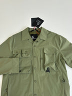 Moncler long jacket in olive green with chest pockets and buttoned placket close-up