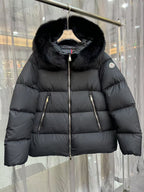 Moncler long puffer jacket with black fur-trim hood, central zip and side zip pockets