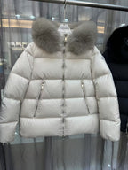 Moncler long puffer jacket with cream fur-trim hood and zip front, pocket zips