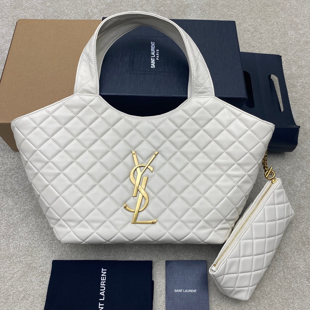 YSL white quilted tote bag with large gold YSL logo and top handles