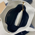 YSL white tote bag open to show dark interior and zipped pocket
