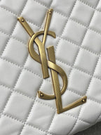 YSL gold logo detail on white quilted leather bag