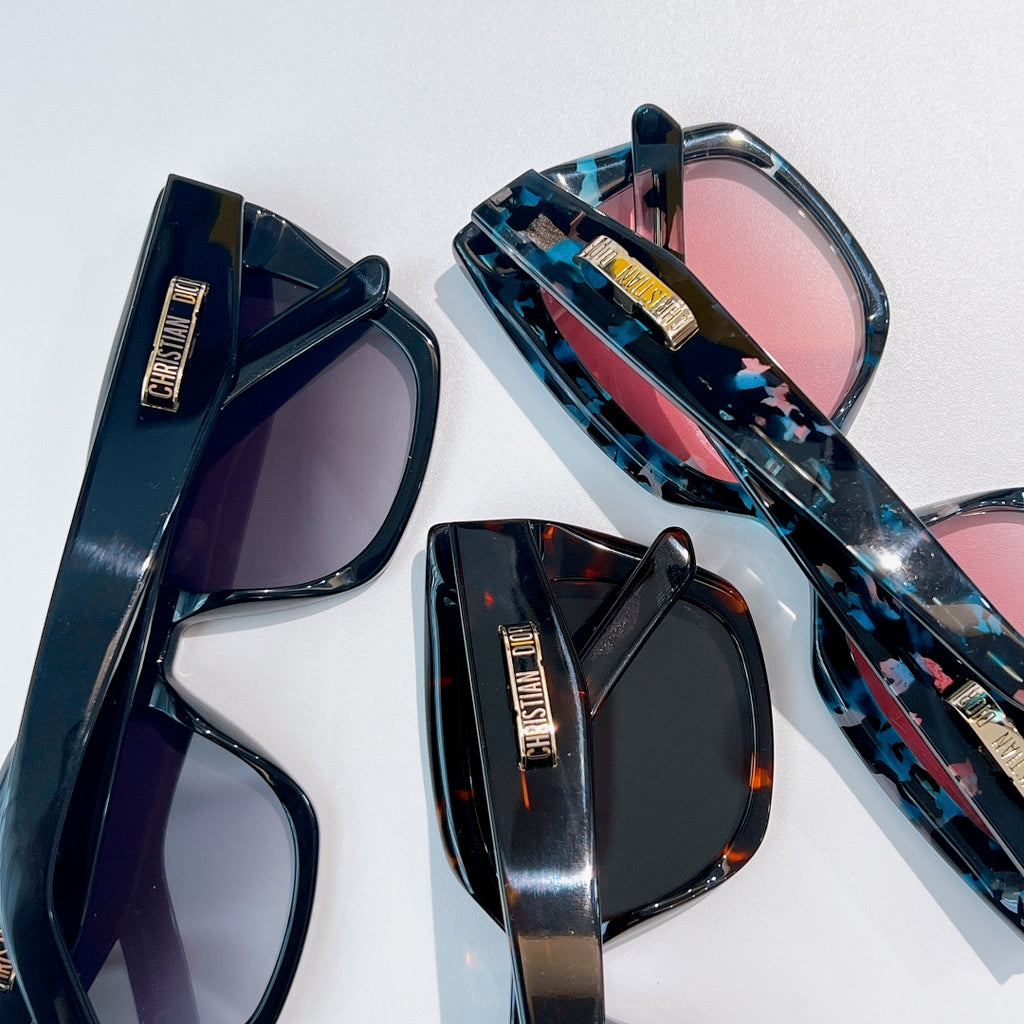 DIOR sunglasses set with blue patterned frames and pink and dark tinted lenses