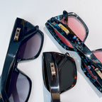 DIOR sunglasses set with blue patterned frames and pink and dark tinted lenses