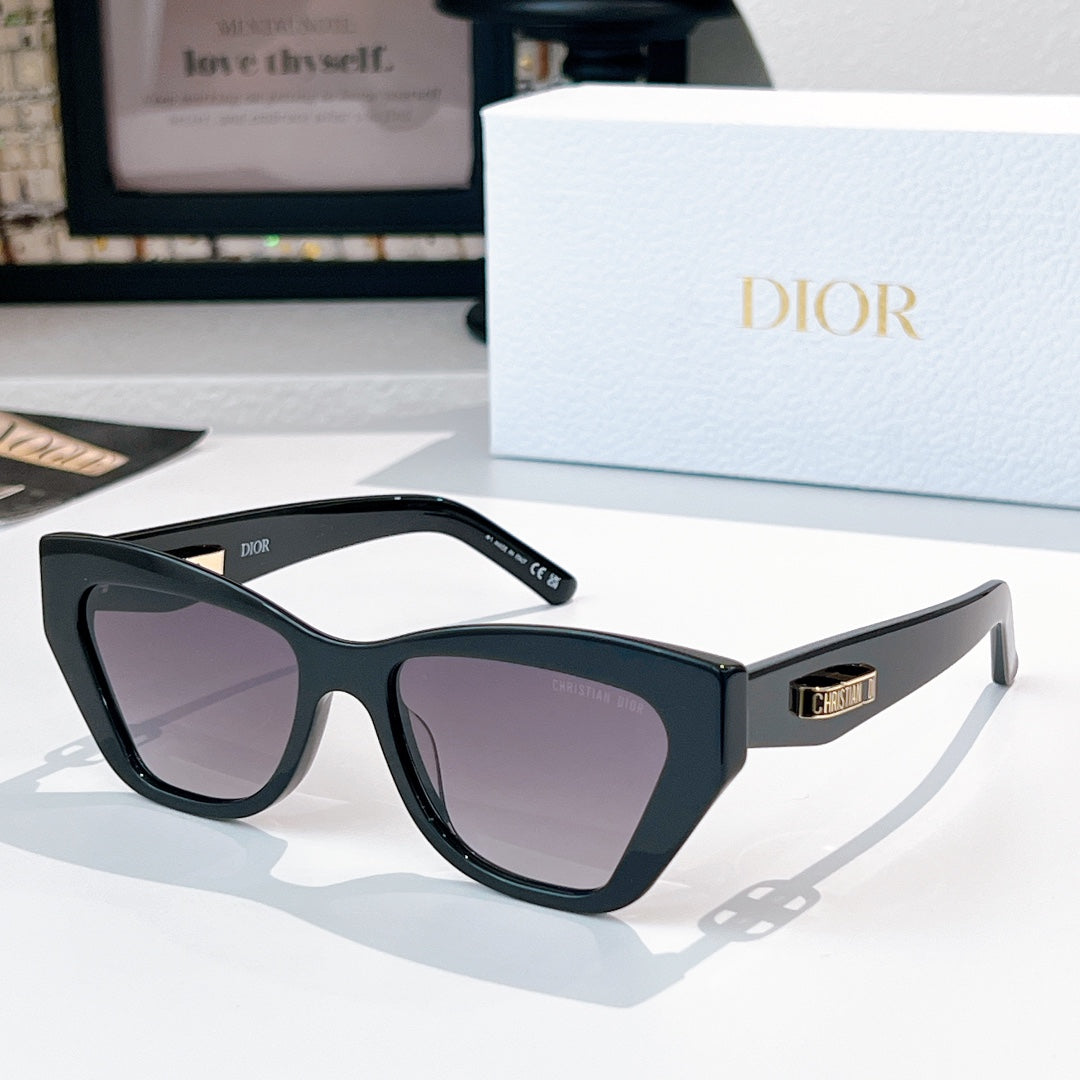 Dior sunglasses with dark frame and violet-tinted lenses.