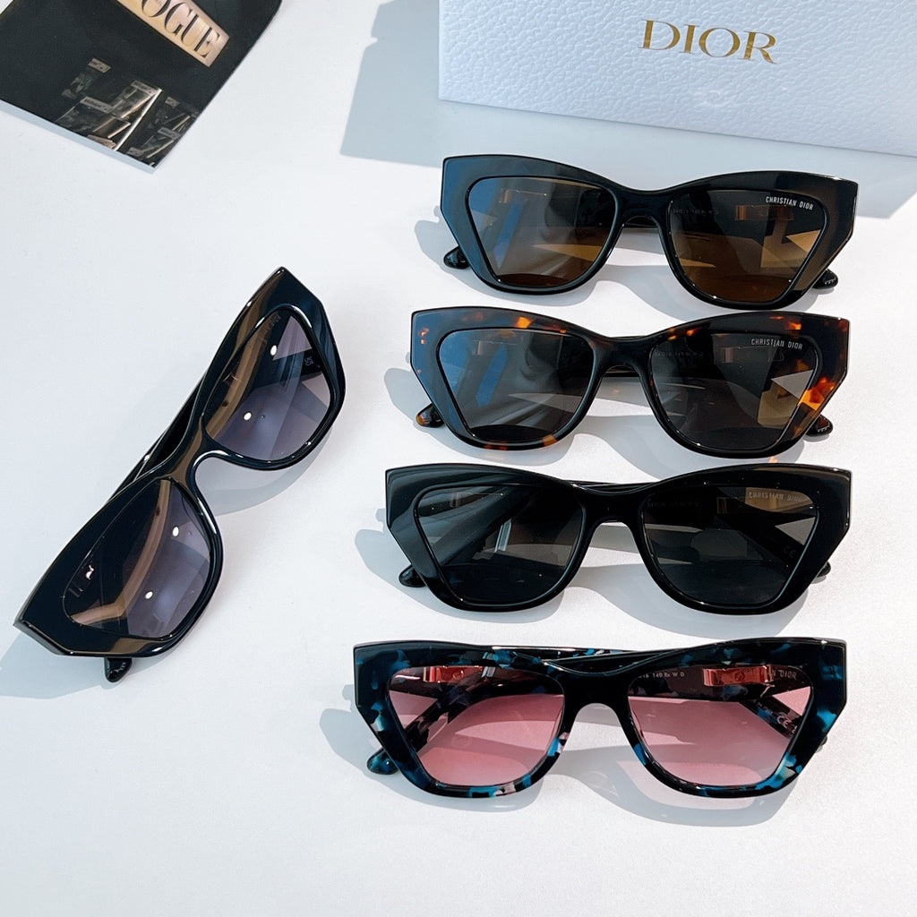 Dior sunglasses assortment with four frames, featuring tinted lenses and teal accents.
