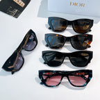Dior sunglasses assortment with four frames, featuring tinted lenses and teal accents.