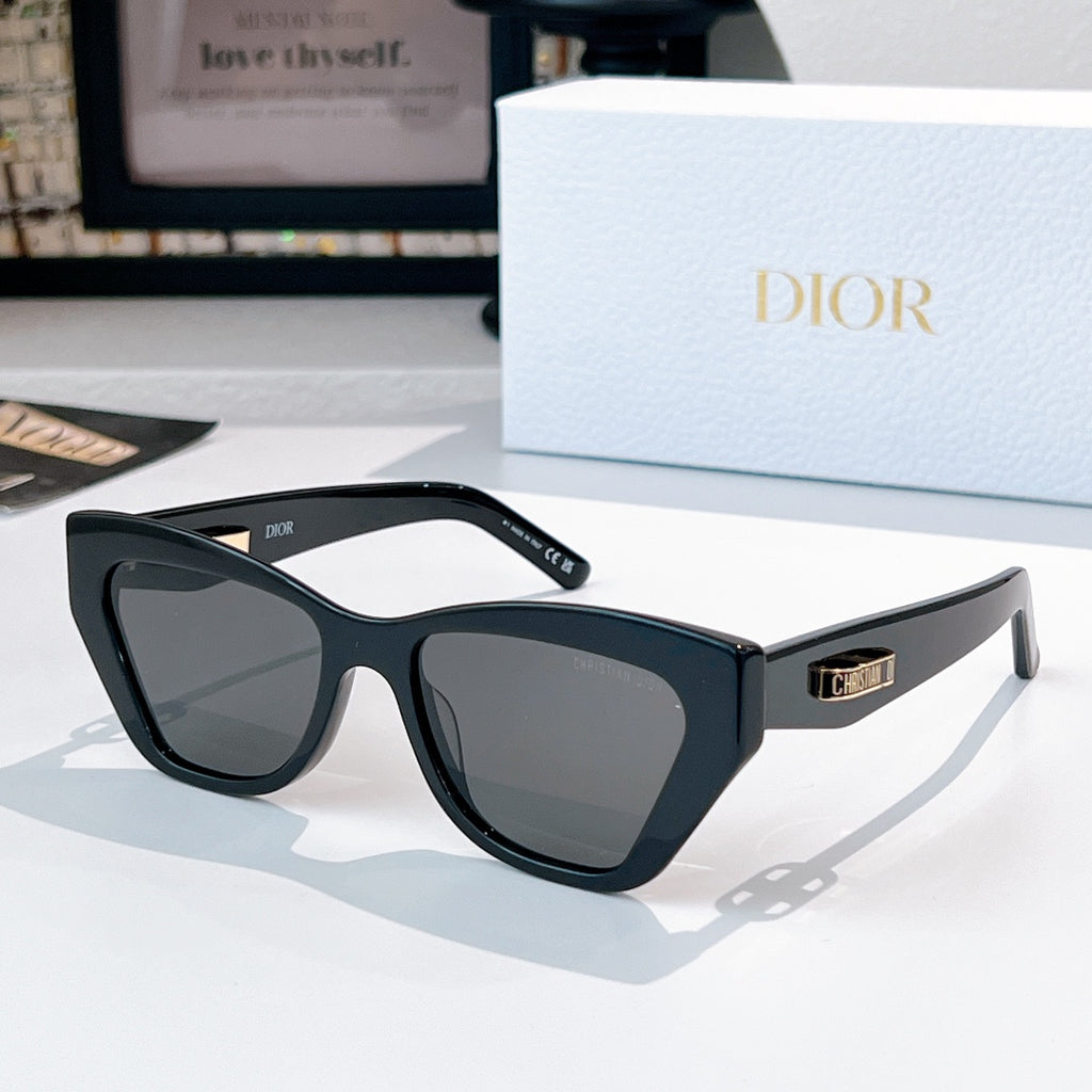 Dior sunglasses with black frame and gray tinted lenses.