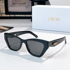 Dior sunglasses with black frame and gray tinted lenses.