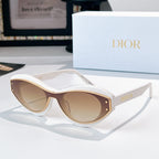 Sunglasses with white frames, gold trim, and light tan lenses