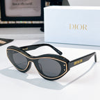 Sunglasses with black frames, gold trim, and dark lenses