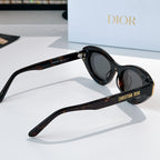 Sunglasses with black frames and dark lenses, side profile