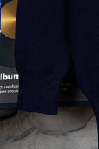 Navy knit polo sweater side hem and sleeve with ribbed knit texture