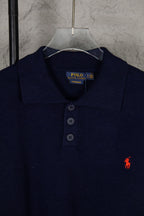 Navy knit polo sweater collar with three-button placket and Polo Ralph Lauren label