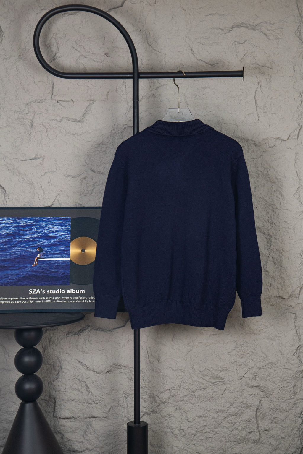 Navy knit polo sweater, back view with ribbed collar and button placket