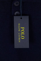 Navy knit polo sweater with hanging Polo Ralph Lauren care and sizing tag