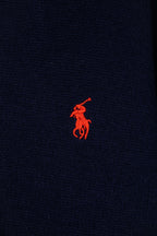 Navy knit polo sweater with small red embroidered logo on chest
