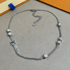 Silver chain necklace with square charms and Louis Vuitton logo centerpiece
