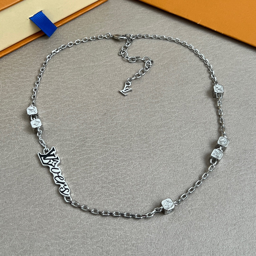 Silver chain necklace with square charms and Louis Vuitton logo centerpiece