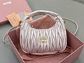 MiuMiu quilted cream mini hobo bag with gold logo on front