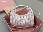 MiuMiu quilted cream mini hobo bag with gold logo on front