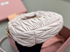MiuMiu cream quilted mini bag with braided top handle and side detail