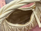 MiuMiu pale yellow mini bag interior view with zip closure and leather lining