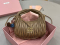 MiuMiu mini hobo bag in olive green with ruched texture and double top handles