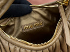 MiuMiu olive green mini hobo bag interior with miu miu leather logo patch