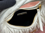MiuMiu light mint hobo bag interior with zip pocket and gold zipper