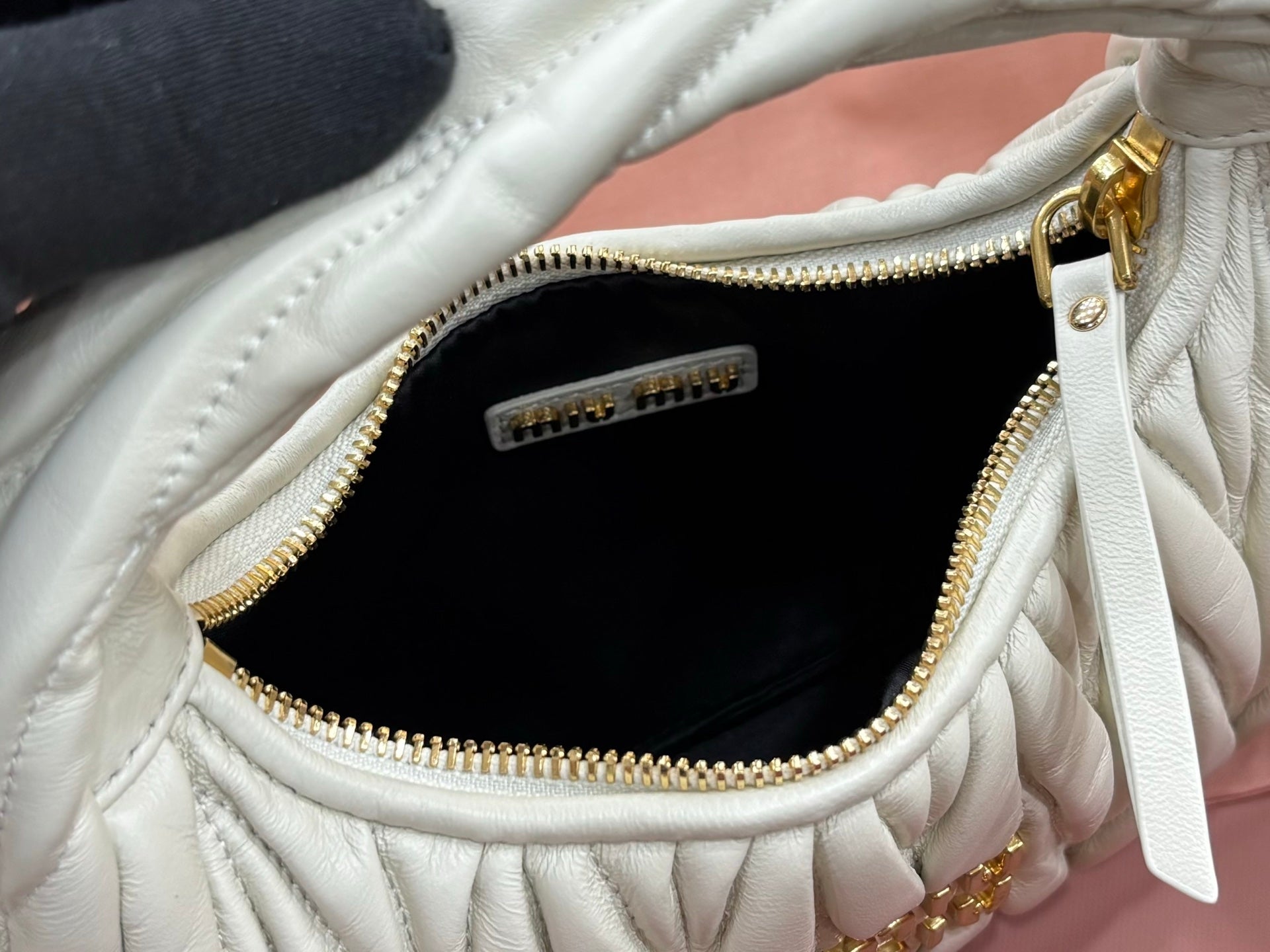 MiuMiu light mint hobo bag interior with zip pocket and gold zipper